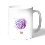 كوب قهوة بتصميم منطاد بالورد