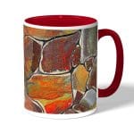 كوب قهوة بمقبض احمر بتصميم صخور ملونه