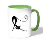 كوب قهوة بمقبض اخضر بتصميم قطه كرتونيه