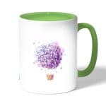 كوب قهوة بمقبض اخضر بتصميم منطاد بالورد