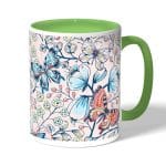 كوب قهوة بمقبض اخضر بتصميم ورود وفراشات