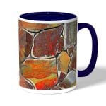 كوب قهوة بمقبض ازرق داكن بتصميم صخور ملونه