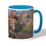 كوب قهوة بمقبض ازرق فاتح بتصميم أبيكس ليجندز سلاح