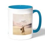 كوب قهوة بمقبض ازرق فاتح بتصميم أساسنز كريد أوريجنز