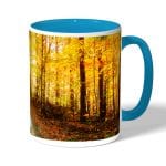 كوب قهوة بمقبض ازرق فاتح بتصميم أوراق الخريف