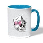 كوب قهوة بمقبض ازرق فاتح بتصميم جمجمه بقبعه