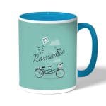 كوب قهوة بمقبض ازرق فاتح بتصميم دراجه هوائيه