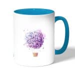 كوب قهوة بمقبض ازرق فاتح بتصميم منطاد بالورد