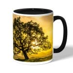 كوب قهوة بمقبض اسود بتصميم شجره الغروب