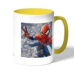 كوب قهوة بمقبض اصفر بتصميم سبايدر مان اعلى البرج