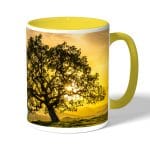 كوب قهوة بمقبض اصفر بتصميم شجره الغروب