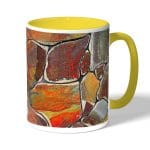 كوب قهوة بمقبض اصفر بتصميم صخور ملونه