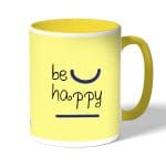 كوب قهوة بمقبض اصفر بتصميم كن سعيد