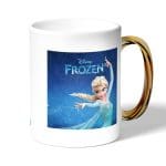 كوب قهوة بمقبض ذهبي بتصميم إلسا ملكة آريندل فروزن