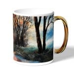 كوب قهوة بمقبض ذهبي بتصميم انعكاس الغروب