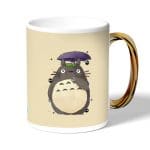 كوب قهوة بمقبض ذهبي بتصميم توتورو