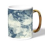 كوب قهوة بمقبض ذهبي بتصميم جينز