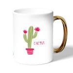 كوب قهوة بمقبض ذهبي بتصميم صبار رسم