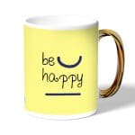 كوب قهوة بمقبض ذهبي بتصميم كن سعيد