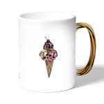 كوب قهوة بمقبض ذهبي بتصميم مثلجات الجماجم