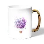 كوب قهوة بمقبض ذهبي بتصميم منطاد بالورد