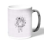 كوب قهوة بمقبض فضي بتصميم بيت العصفور