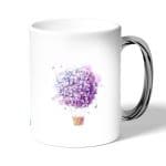 كوب قهوة بمقبض فضي بتصميم منطاد بالورد