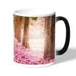 كوب قهوة سحري لون اسود بتصميم اشجار الساكورا