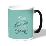 كوب قهوة سحري لون اسود بتصميم دراجه هوائيه