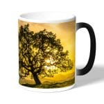 كوب قهوة سحري لون اسود بتصميم شجره الغروب