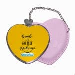 مرآة جيب جلد قلب بتصميم ابتسامه