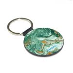 ميدالية مفاتيح دائرية بتصميم ذهبي وأخضر